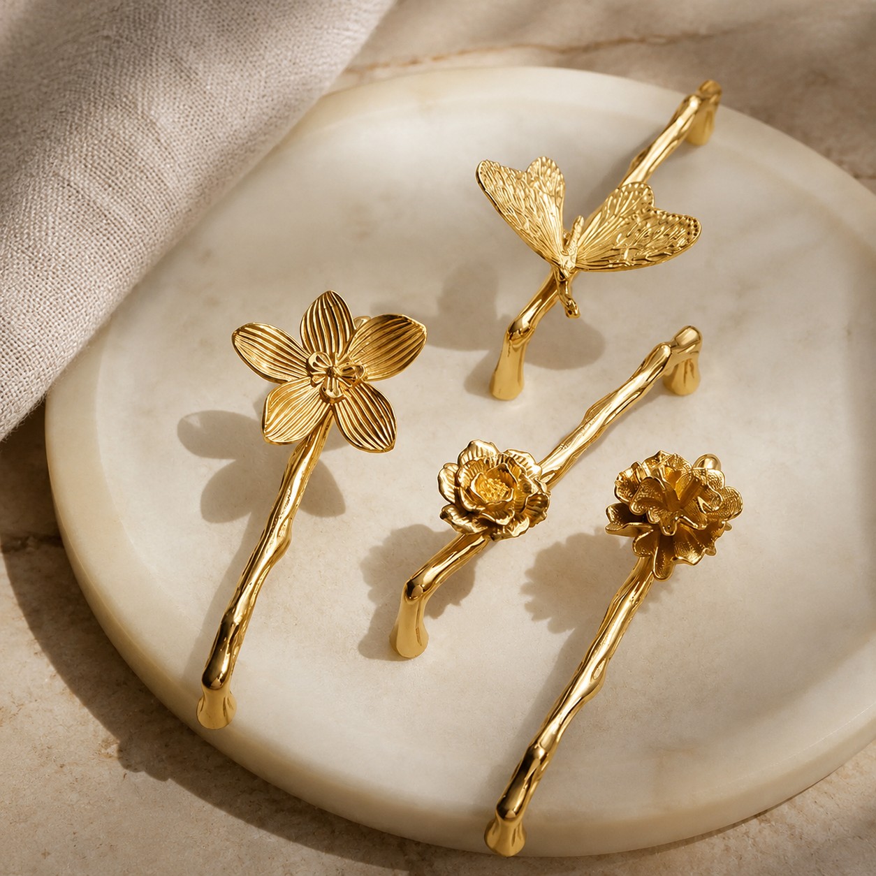 Brass flower and branch handles styled on cabinetry