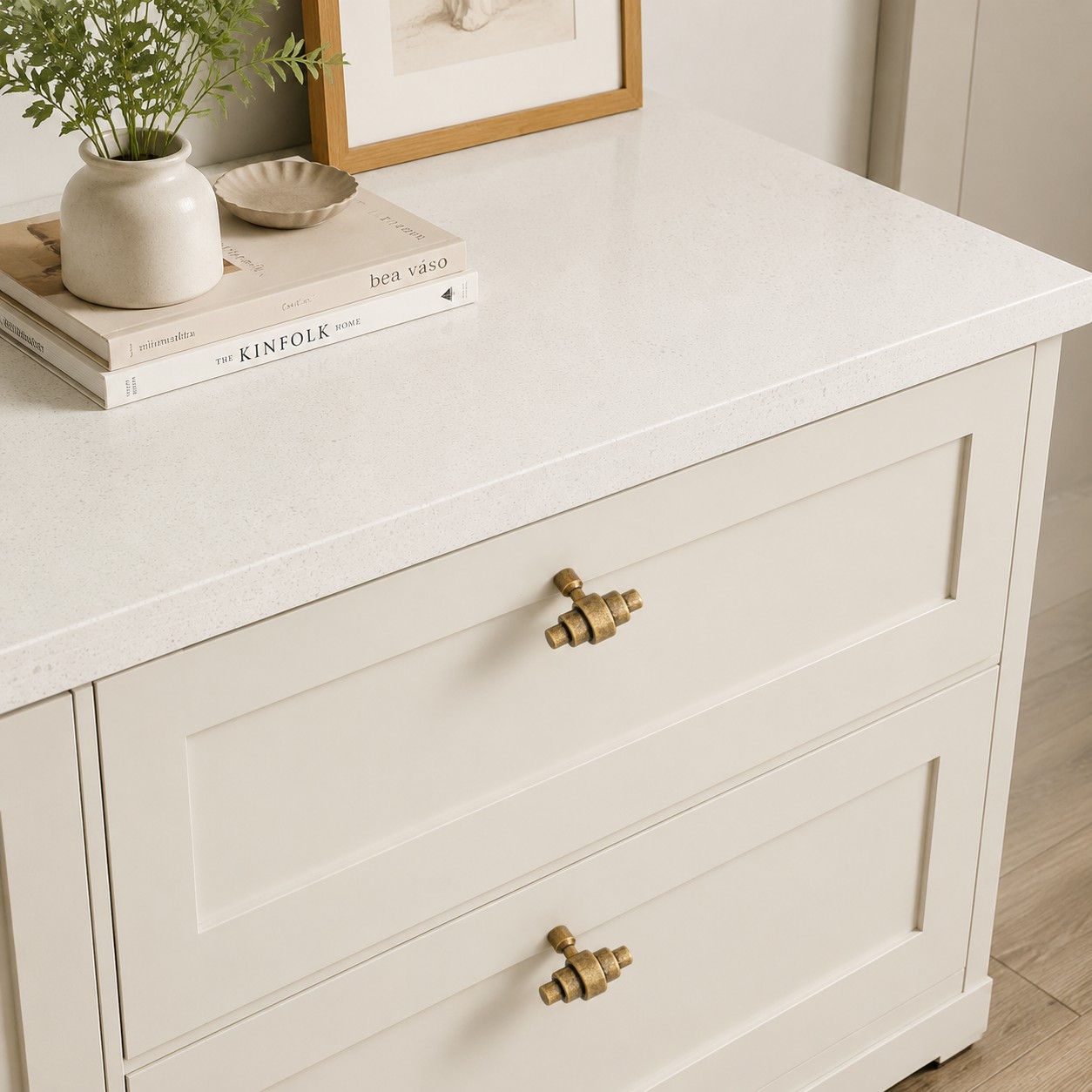 Antique brass handles installed on white drawers