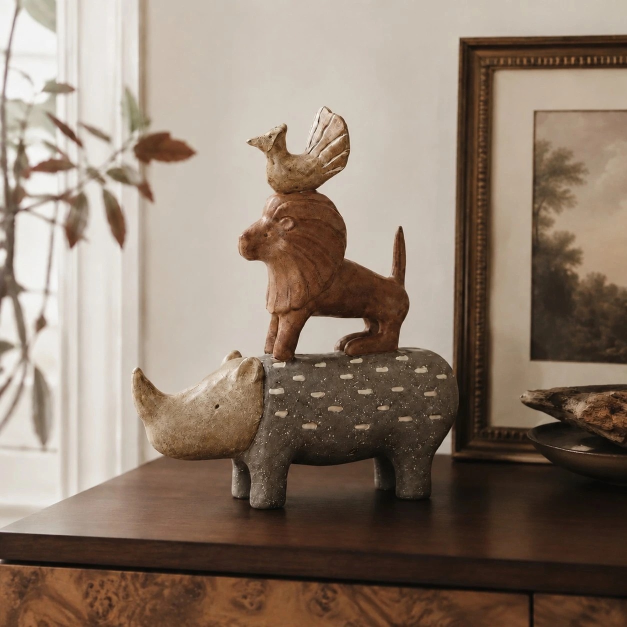 Resin animal shelf decor arranged in a home display setting