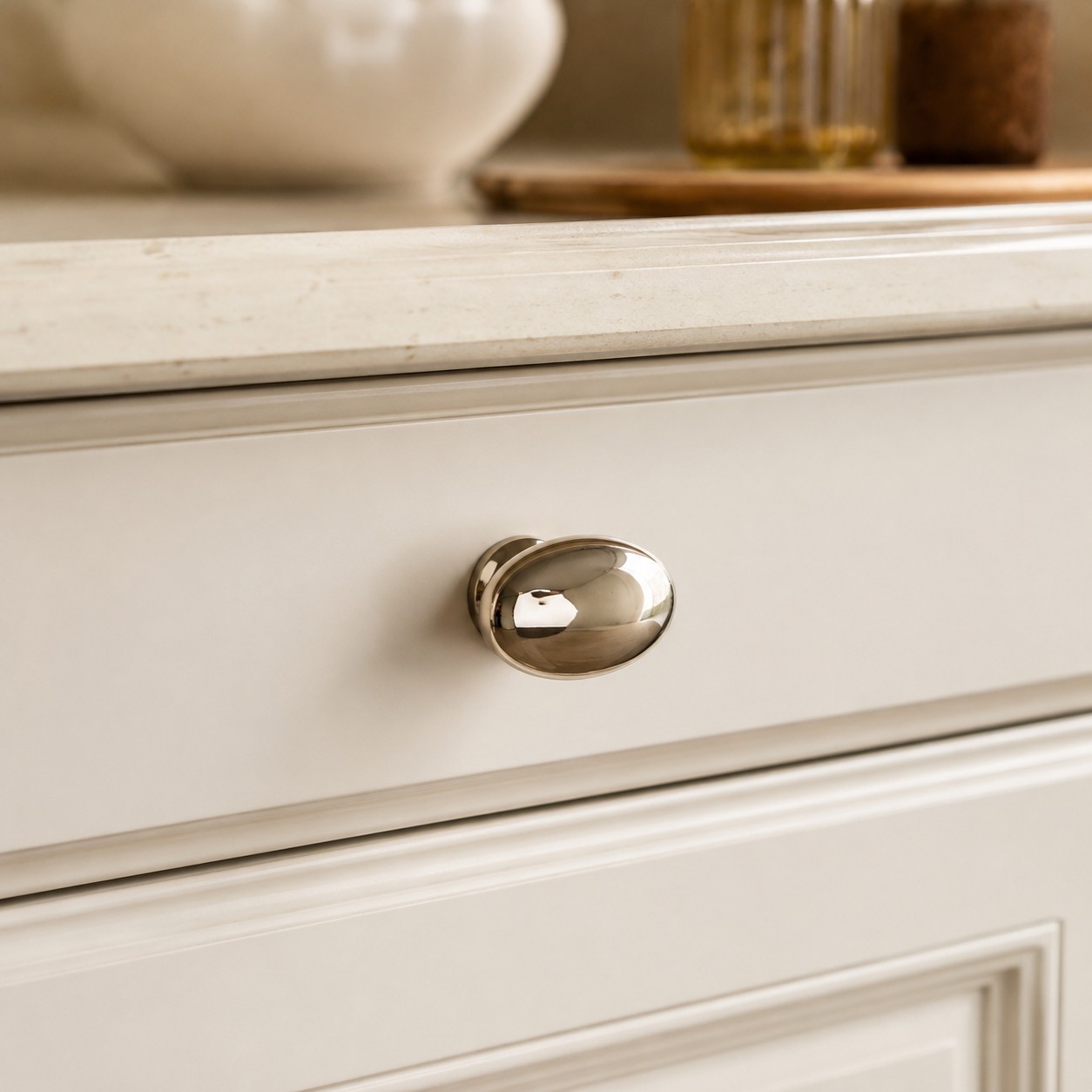 Solid brass cabinet knob installed on furniture