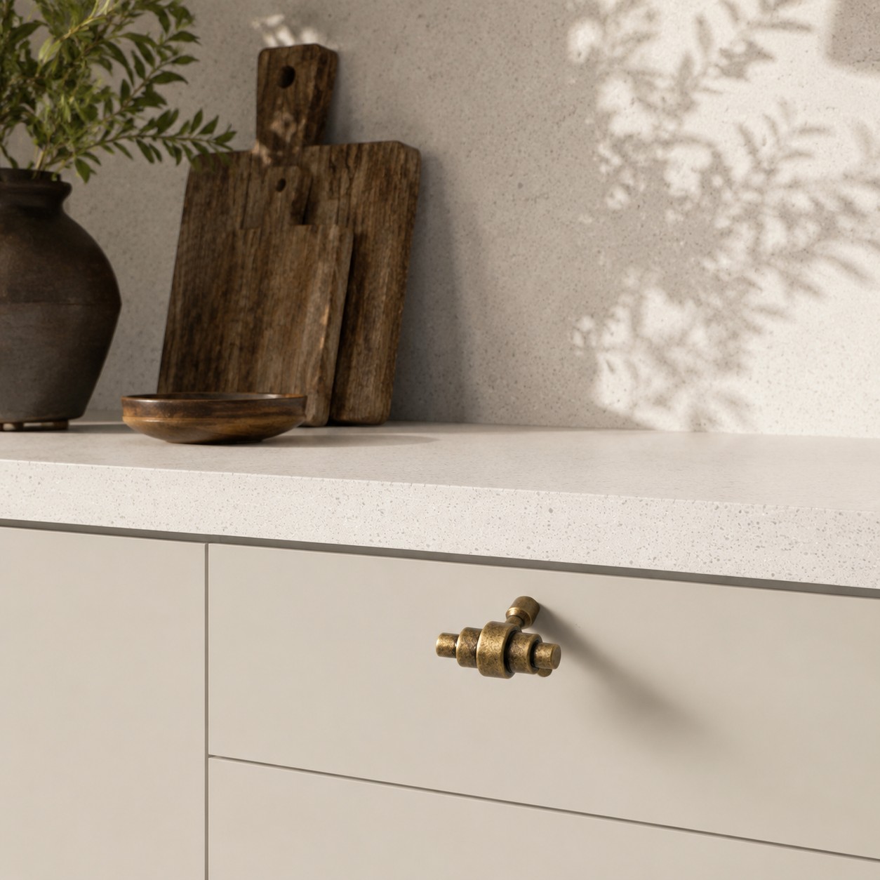 Antique brass cabinet handle in a warm modern interior