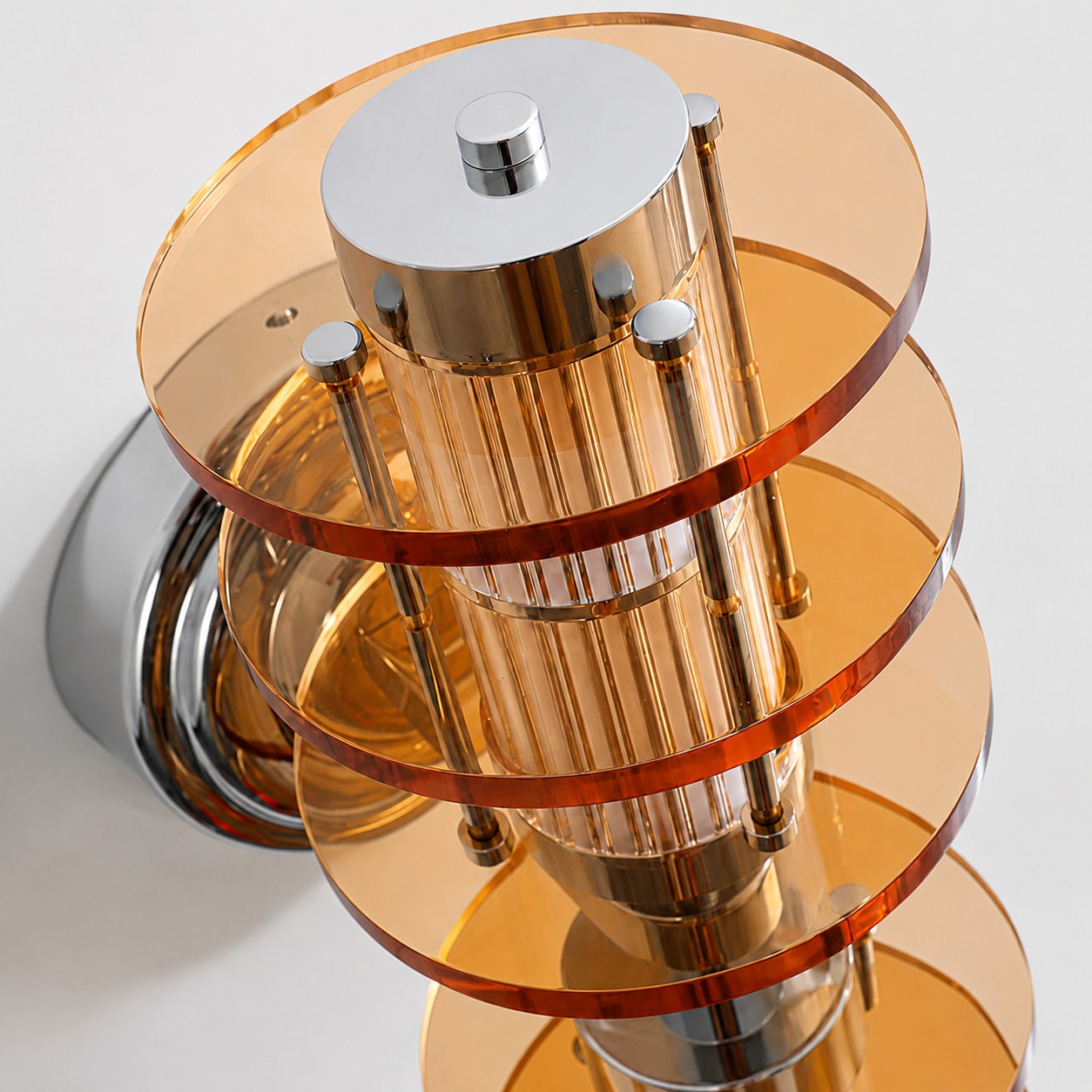 Vertical Bauhaus wall lamp amber acrylic layered disc close-up