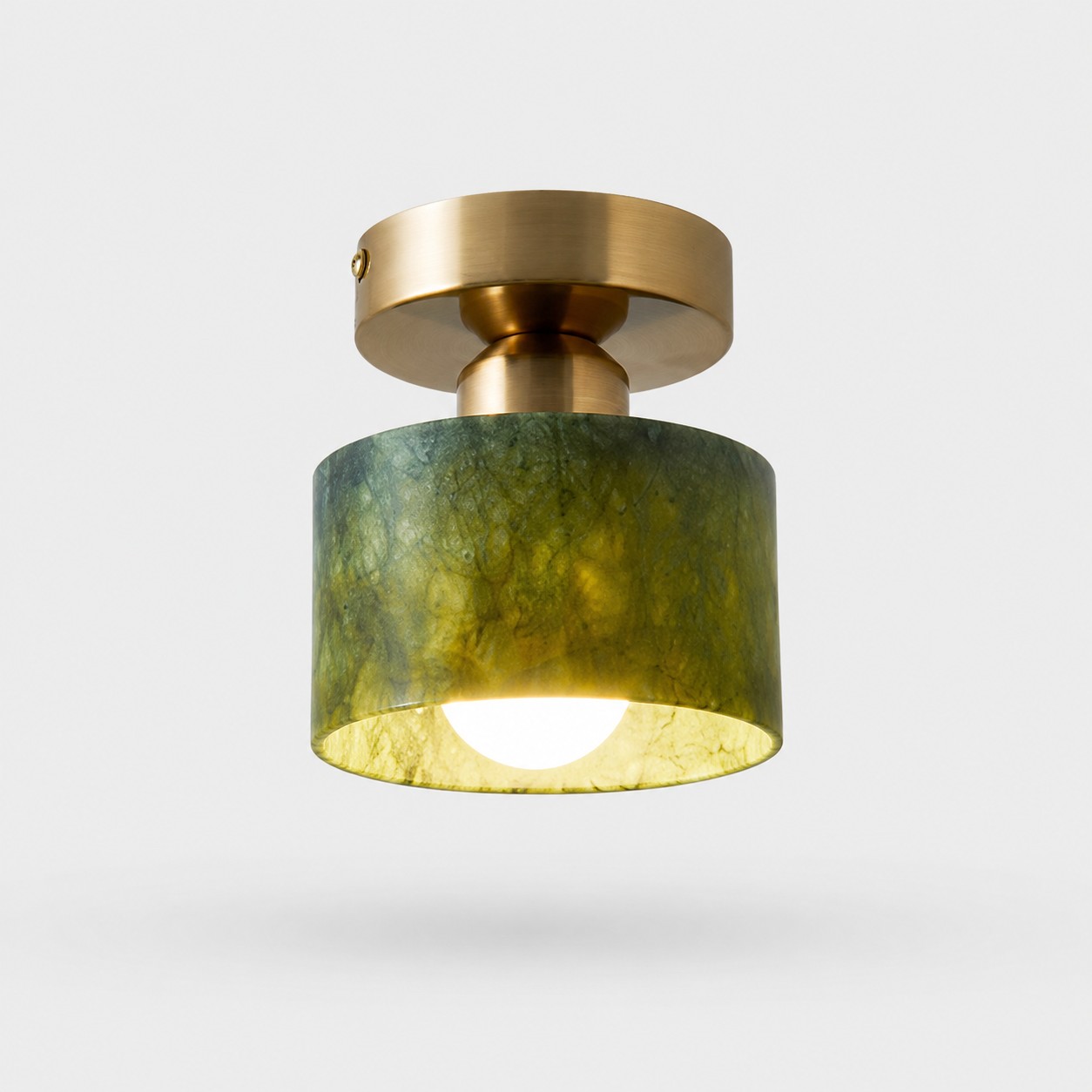 jade and gold ceiling light on gray background