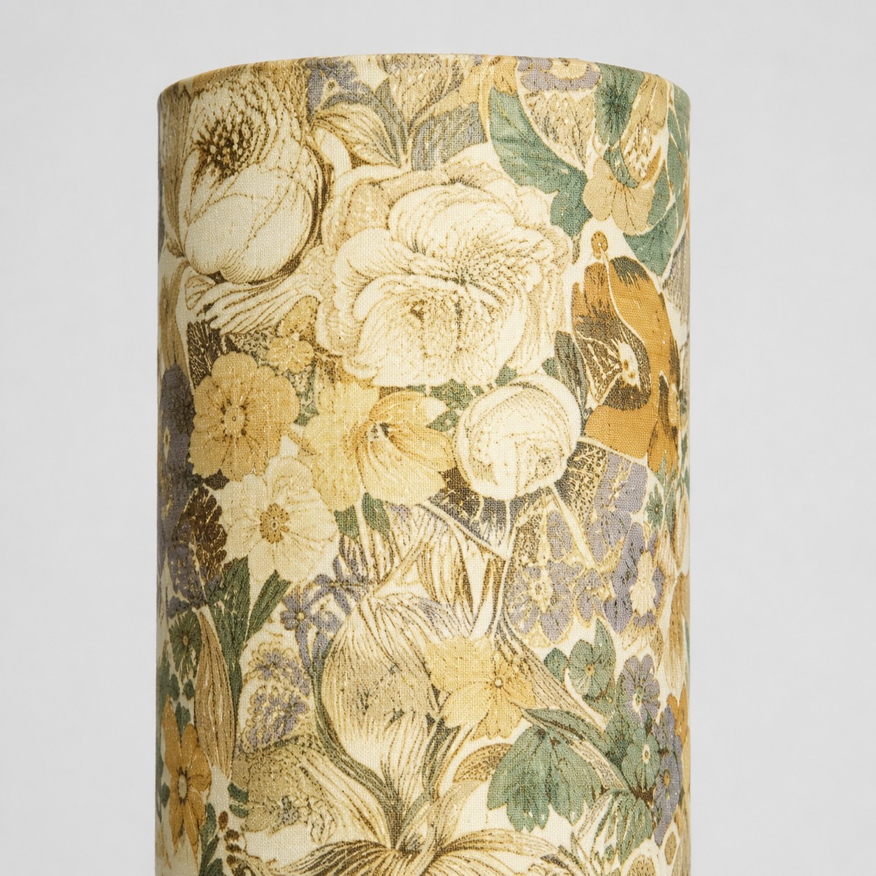 Close-up of vintage ivory floral Liberty fabric cylindrical lampshade texture