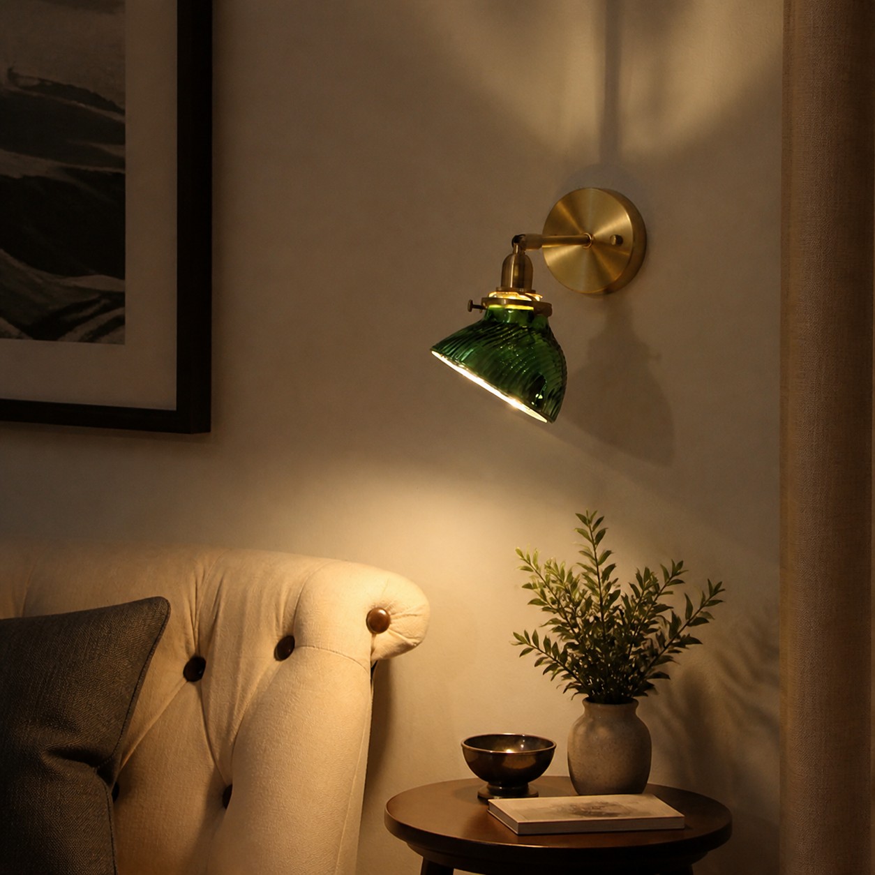 Green glass wall lamp installed beside a lounge chair