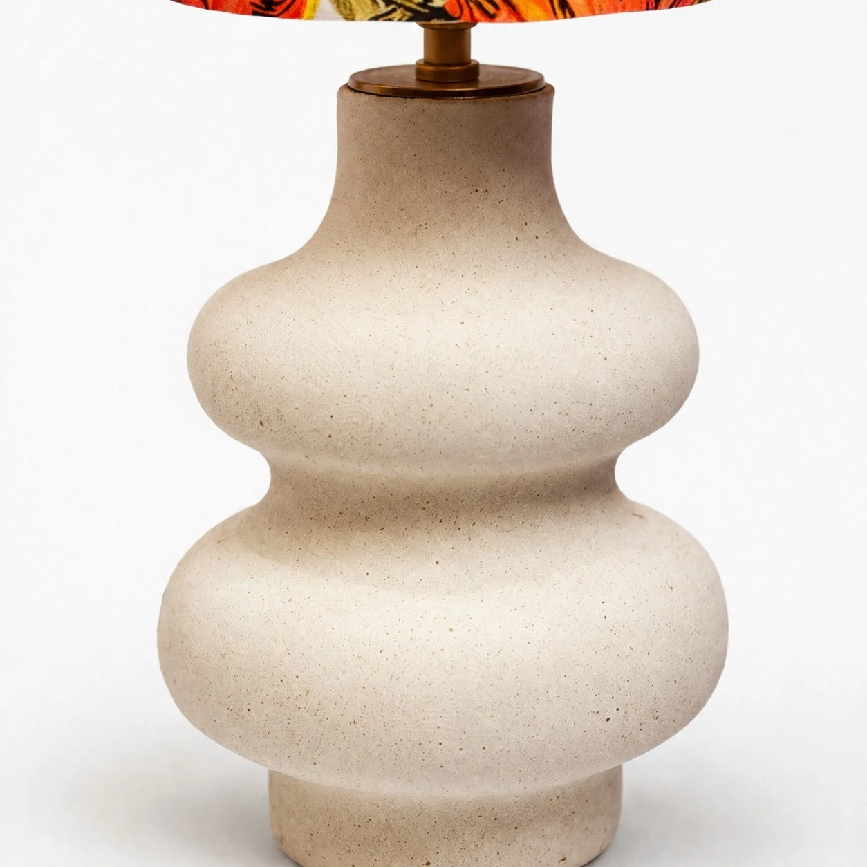 Close view of rounded handmade ceramic lamp base
