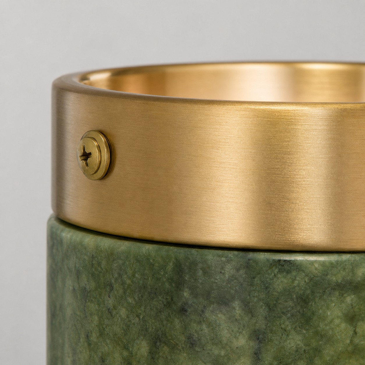 Brass tone metal rim and screw detail