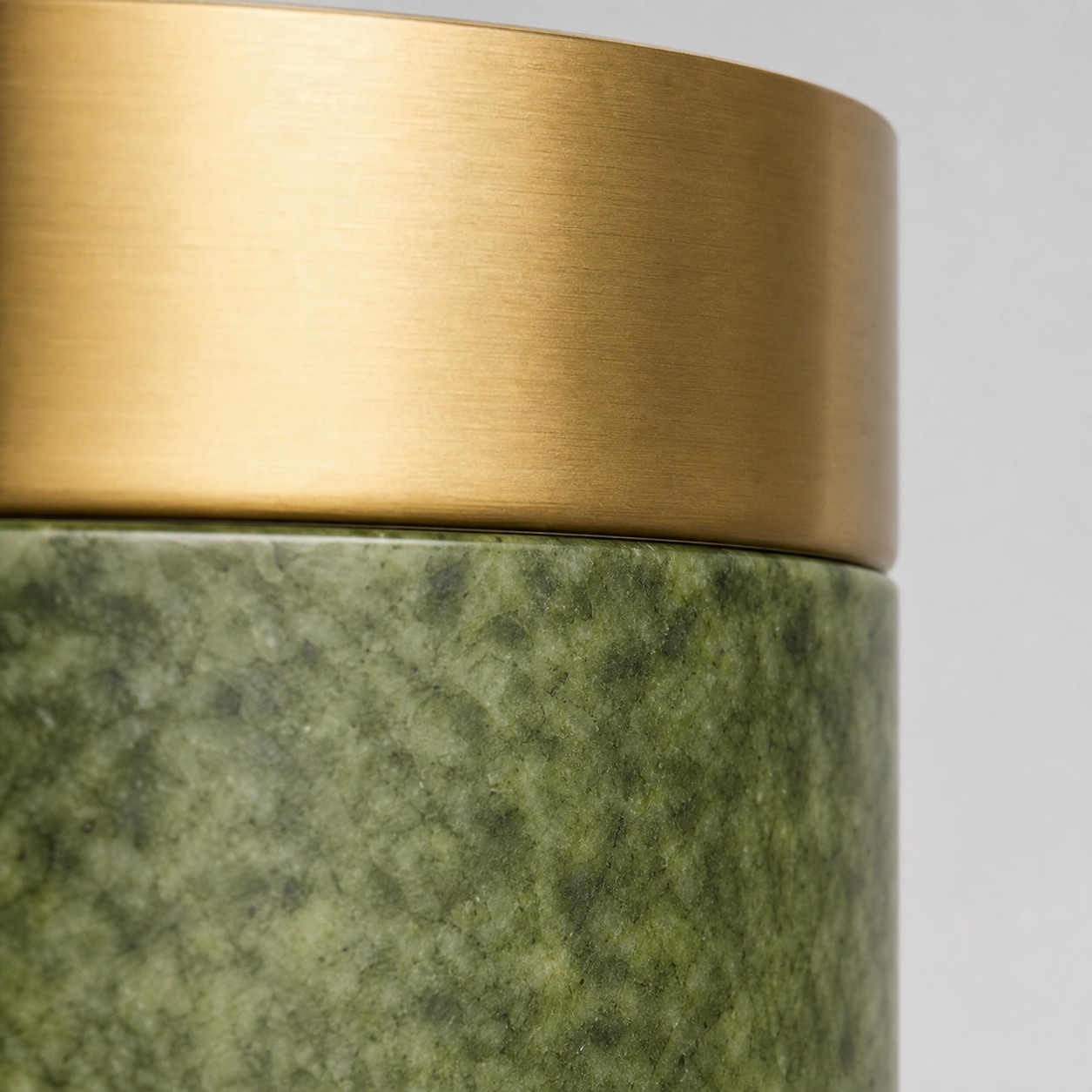 Side view of green jade stone and metal finish
