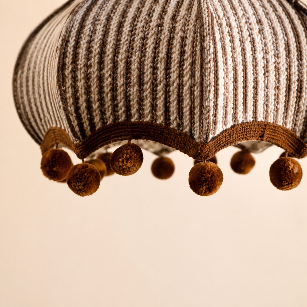 Woven striped fabric shade and pom-pom trim detail