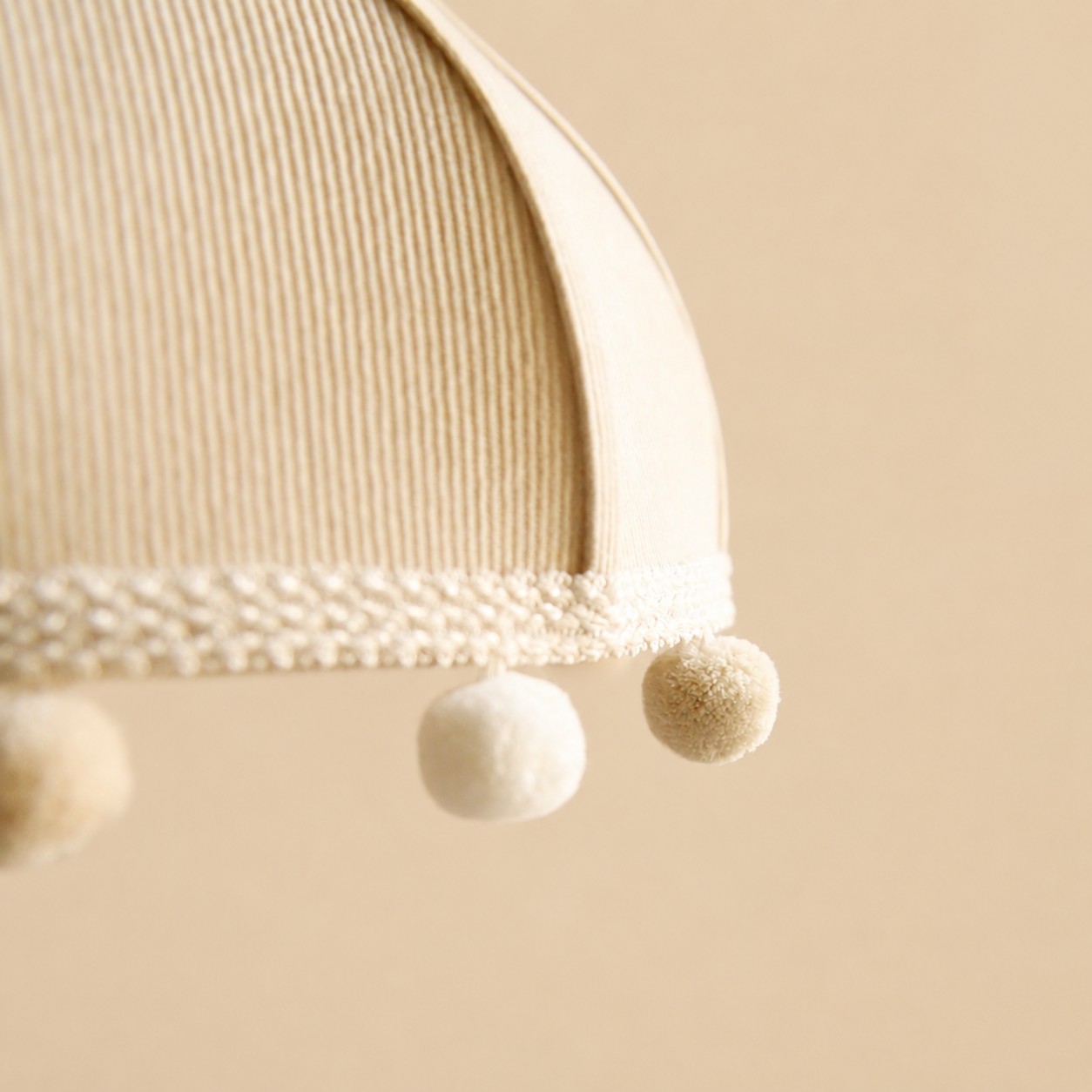 Milk White ribbed fabric and pom-pom trim detail