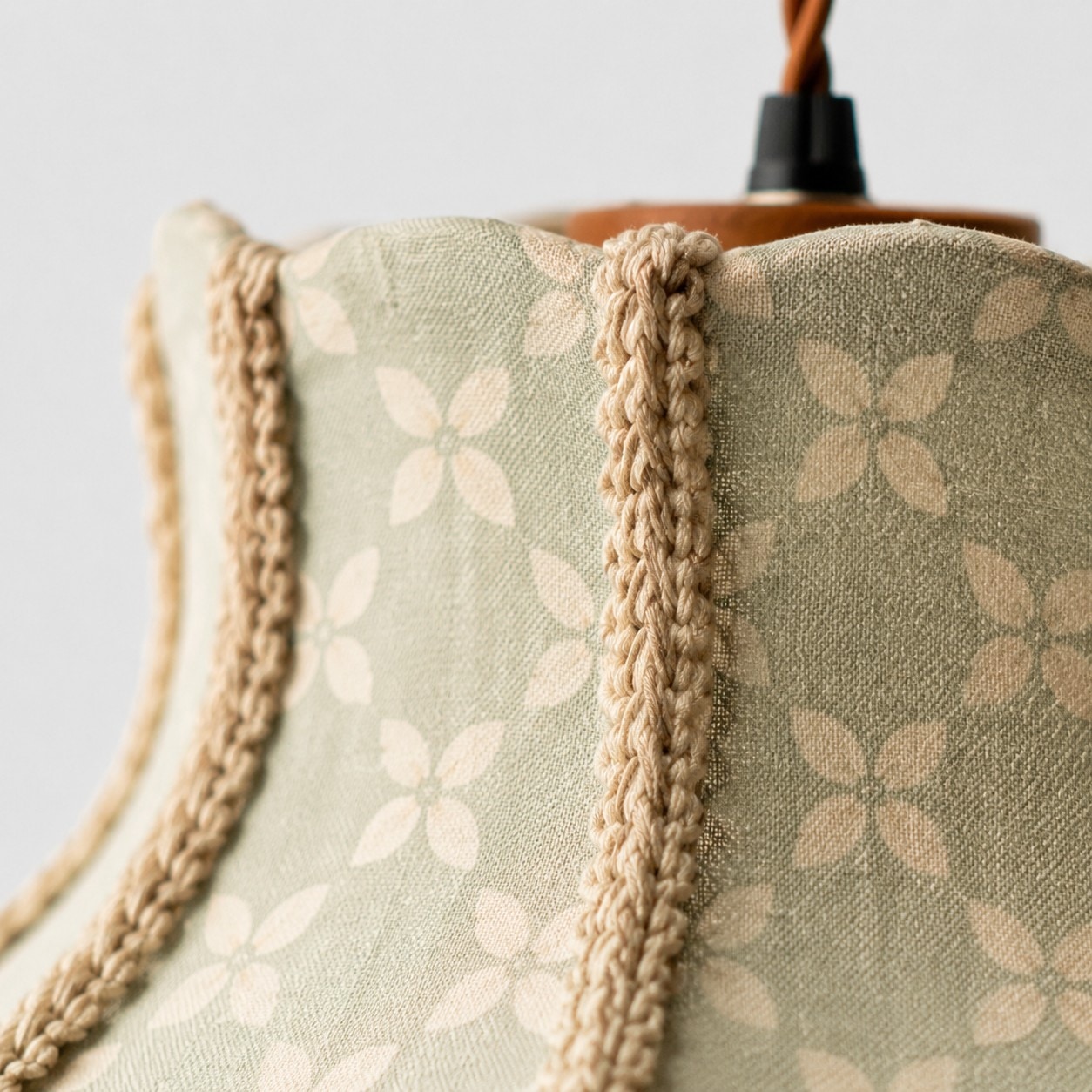 Sage floral fabric shade collar and braided trim detail