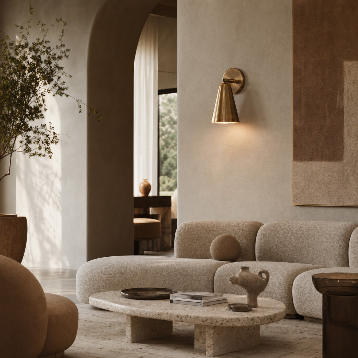 Aged brass cone wall sconce in a seating area