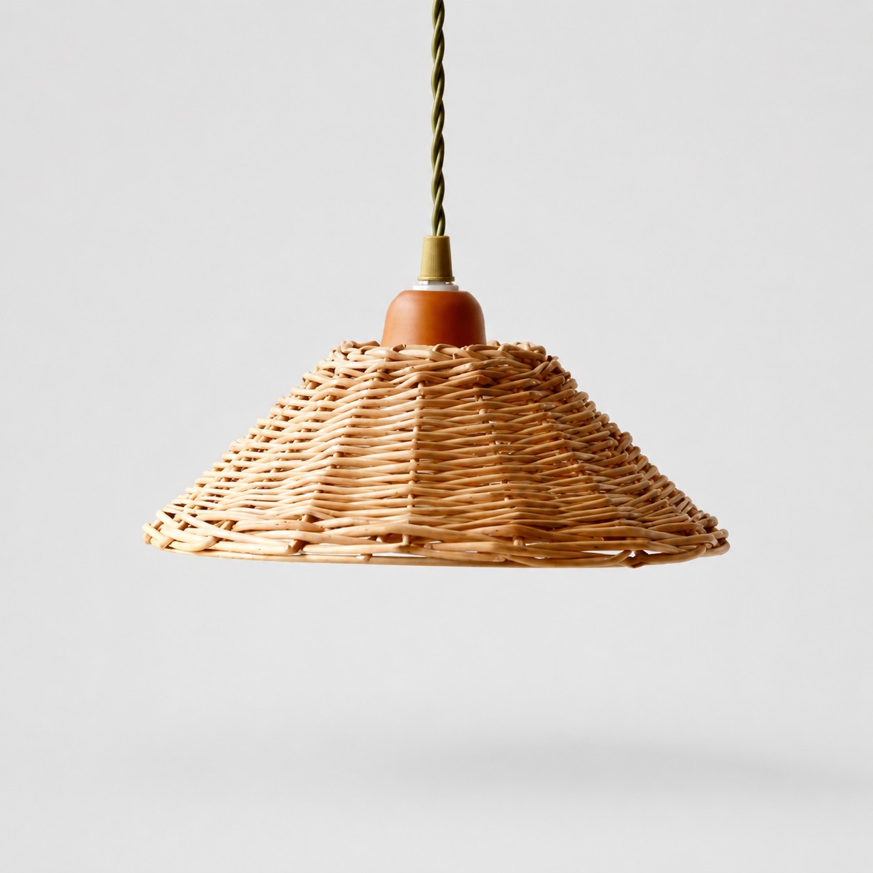 Natural woven rattan mini pendant lamp on a light background