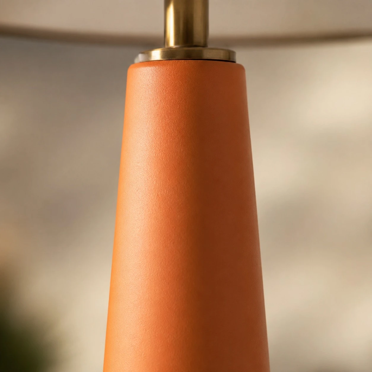 Orange ceramic table lamp neck detail