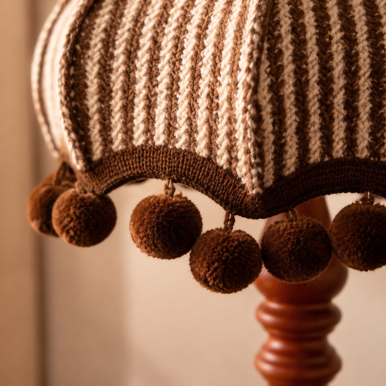 Scalloped striped fabric shade and pom-pom trim detail