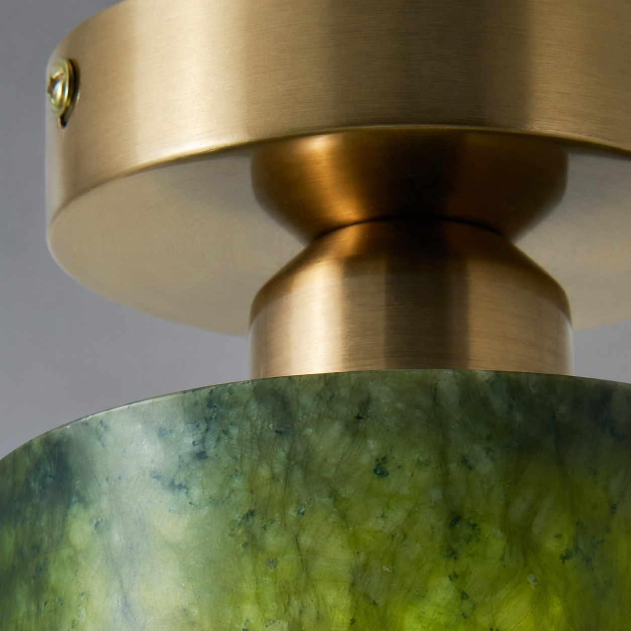 close view of brushed gold metal ceiling plate
