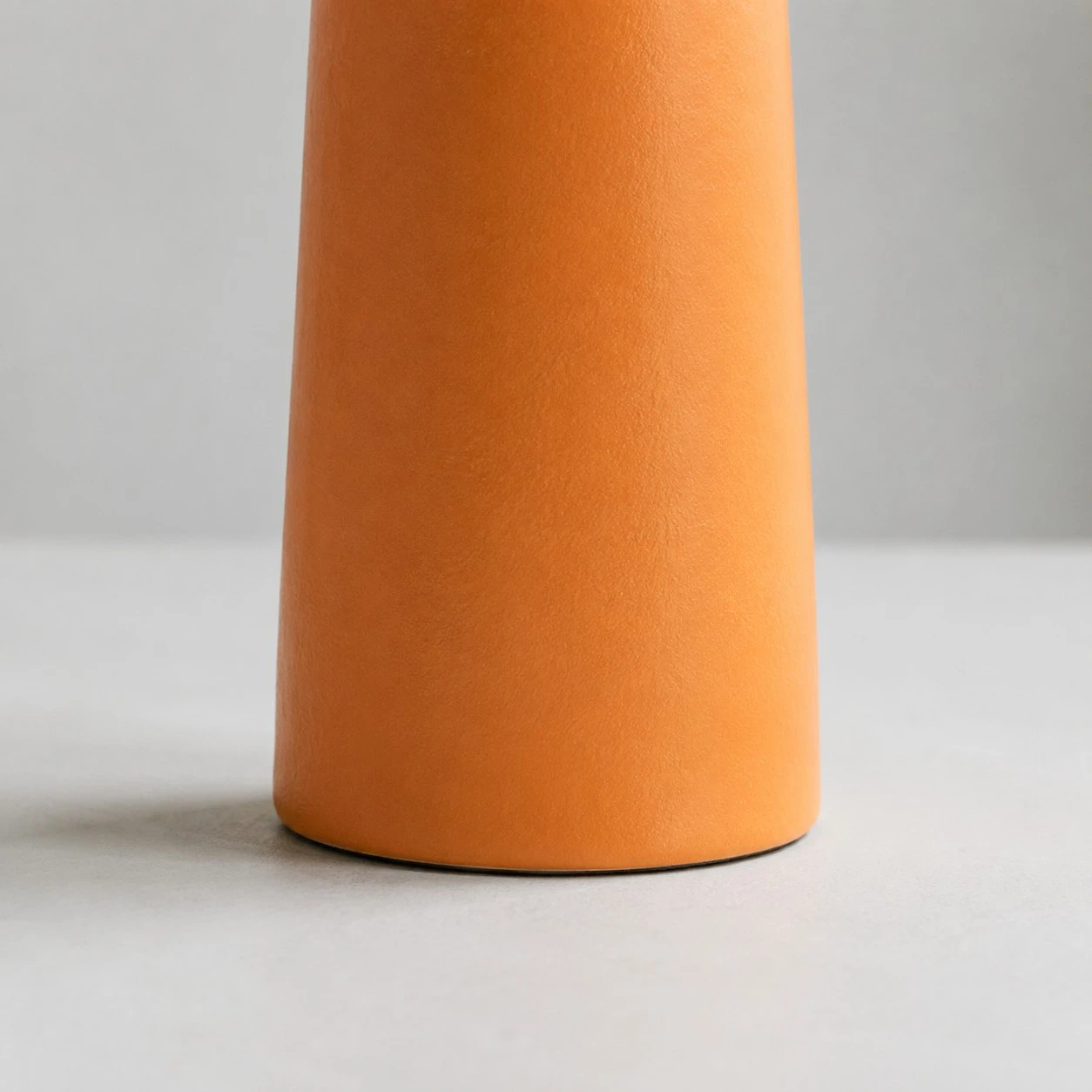 Orange ceramic base matte finish close up