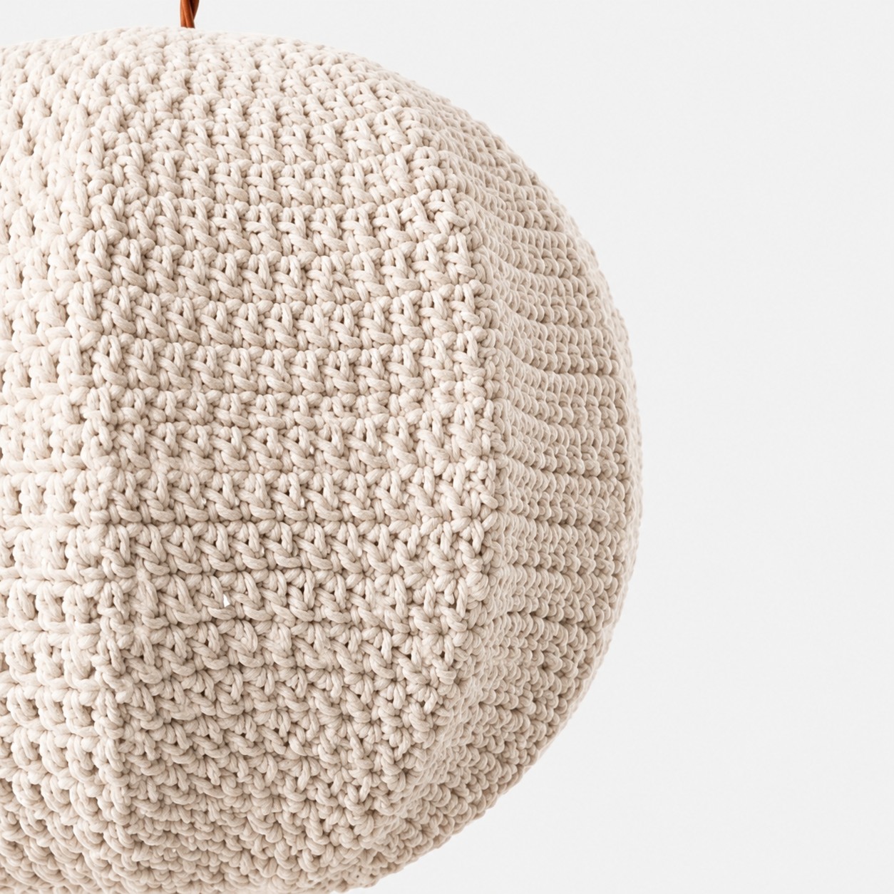 Angled close-up of mixed stitch panels on the ivory globe shade