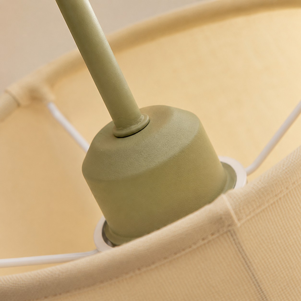Fabric shade support and painted metal socket housing detail