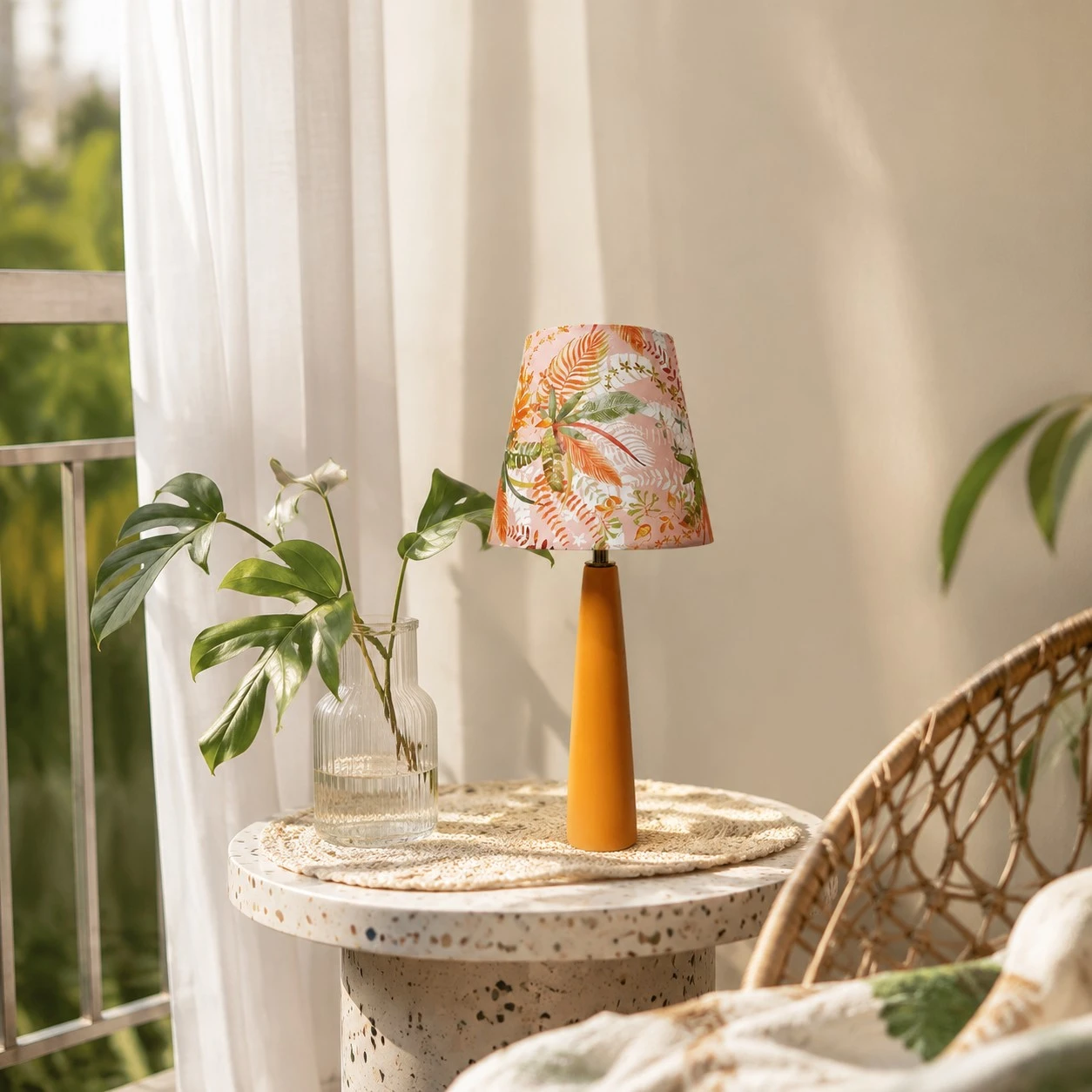 Floral ceramic table lamp styled near a bright reading corner