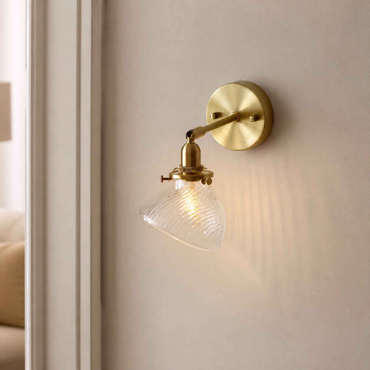 Clear glass wall sconce close room setting